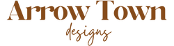 Logo of Arrow Town designs with a brown color on a white background