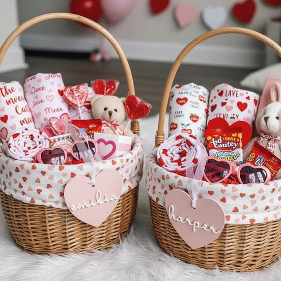Valentine gift baskets with pink personalized heart tags, toys and treats.