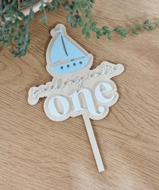 Sailboat First Birthday Cake Topper  Sailing Into One  Nautical 1st Birthday Decor  Personalized Name Option  Blue & White