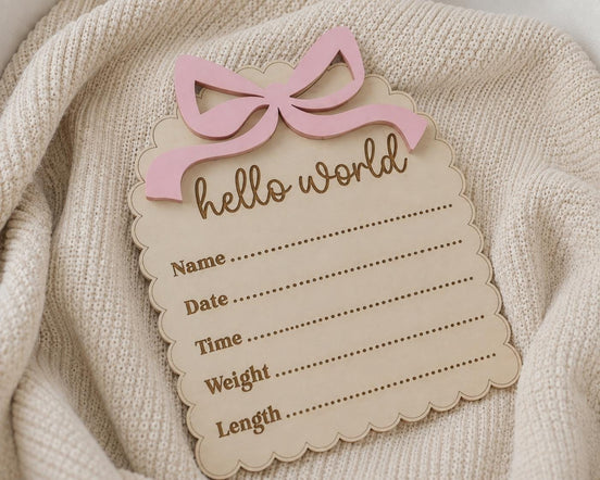Close-up of the Hello World birth plaque with blank name, date, time, weight and length lines.